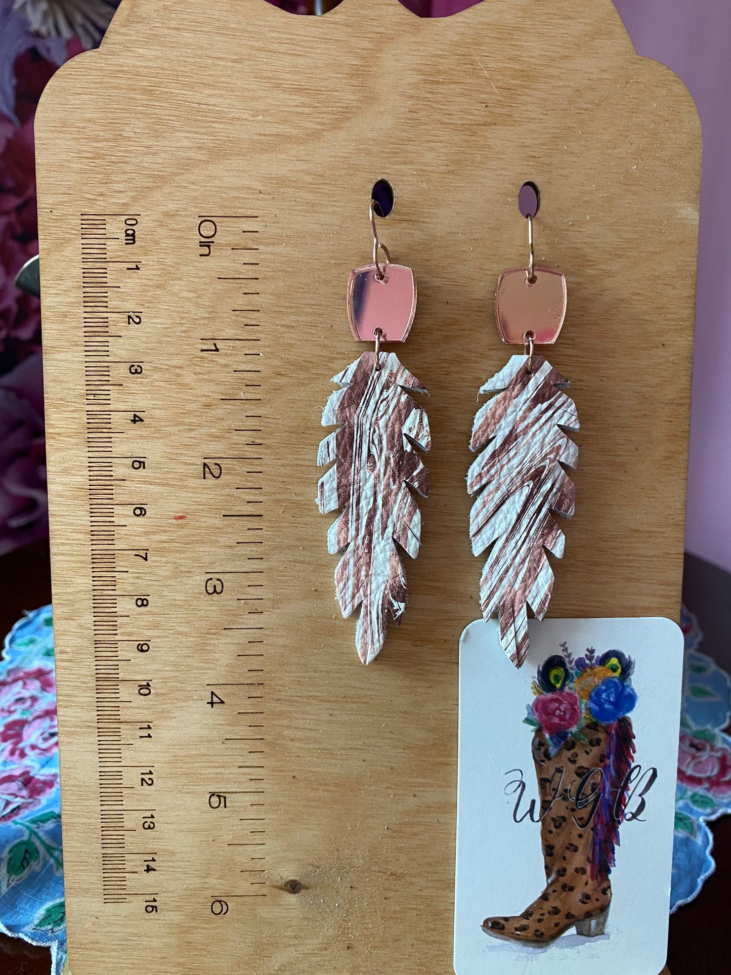 Double Sided Feather Earrings with Mirrored Rose Gold Connectors, Root Beer Swirl on White Leather, Boho Feather Earrings, Medium Length