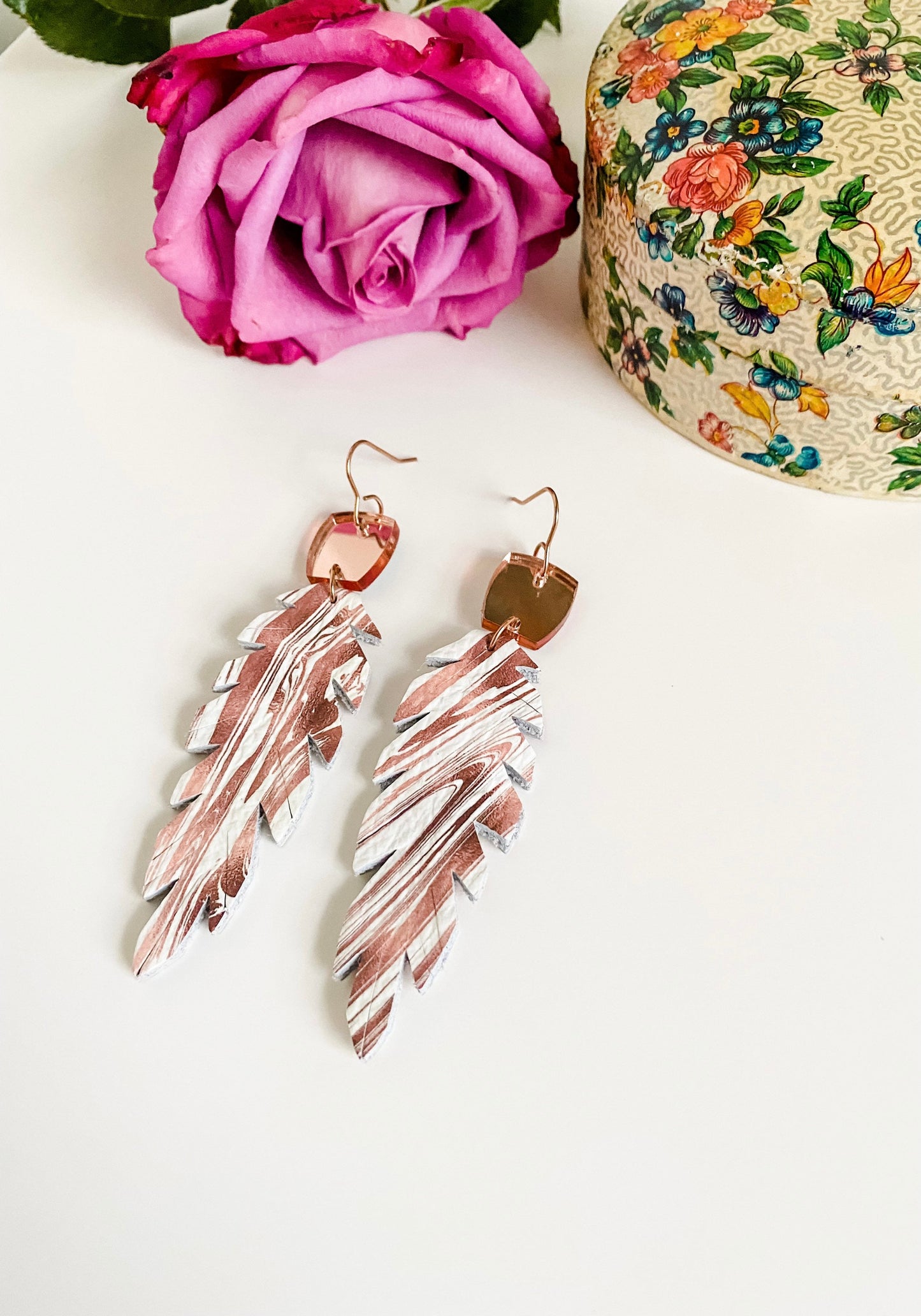 Double Sided Feather Earrings with Mirrored Rose Gold Connectors, Root Beer Swirl on White Leather, Boho Feather Earrings, Medium Length